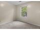 Carpeted bedroom with natural light from a large window at 7920 Parklane Ct # 608, North Charleston, SC 29418