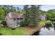 Exterior view of a multi-story home with a screened porch overlooking a waterway at 7920 Parklane Ct # 608, North Charleston, SC 29418