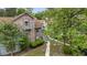 Exterior of the home with lush landscaping, steps, and trees at 7920 Parklane Ct # 608, North Charleston, SC 29418