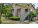 Exterior view of a multi-story home with stairs leading to the front door at 7920 Parklane Ct # 608, North Charleston, SC 29418
