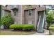 Charming condo shows inviting exterior with lush landscaping and private entrance at 7920 Parklane Ct # 608, North Charleston, SC 29418