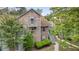 Exterior view of a multi-story home with a small balcony overlooking the yard at 7920 Parklane Ct # 608, North Charleston, SC 29418