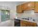 Kitchen with wood cabinets and access to a screened porch at 7920 Parklane Ct # 608, North Charleston, SC 29418