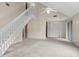 Spacious living room features staircase and vaulted ceiling with ceiling fan at 7920 Parklane Ct # 608, North Charleston, SC 29418