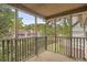 View from the screened porch looking out over the pond and surrounding trees at 7920 Parklane Ct # 608, North Charleston, SC 29418