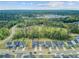 Expansive aerial shot of a community featuring newly built homes and green spaces at 86 Red Bluff St, Summerville, SC 29483
