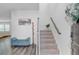 Entryway featuring a staircase, bench, and contemporary decor at 86 Red Bluff St, Summerville, SC 29483