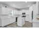 Modern kitchen features white cabinetry, stainless steel appliances, and ample counter space for cooking at 86 Red Bluff St, Summerville, SC 29483