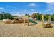 Community playground with a boat-themed play structure featuring a slide, climbing area, and swing set on a wood chip ground at 86 Red Bluff St, Summerville, SC 29483