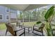 Relaxing screened porch with comfortable seating overlooking the backyard at 86 Red Bluff St, Summerville, SC 29483