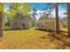 Spacious backyard with a two-story house and a shed at 8961 N Red Maple Cir, Summerville, SC 29485