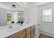 Bathroom with double vanity sinks, bright natural light, and modern fixtures at 8961 N Red Maple Cir, Summerville, SC 29485