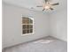 Bright, carpeted bedroom with a ceiling fan and window for natural light at 8961 N Red Maple Cir, Summerville, SC 29485