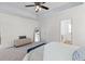 Bedroom featuring ceiling fan, en suite bathroom, and bright natural light at 8961 N Red Maple Cir, Summerville, SC 29485