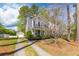 Charming two-story home with a well-manicured lawn, long driveway, and detached garage at 8961 N Red Maple Cir, Summerville, SC 29485