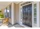 Close-up of a classic black front door framed by sidelights, showcasing the home's inviting entrance at 8961 N Red Maple Cir, Summerville, SC 29485
