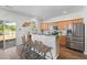 Kitchen featuring stainless steel appliances, hardwood floors and breakfast bar at 8961 N Red Maple Cir, Summerville, SC 29485