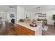 Kitchen view featuring breakfast bar with hardwood floors and modern lighting at 8961 N Red Maple Cir, Summerville, SC 29485