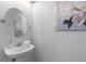 Tasteful powder room showcasing a modern sink, artistic mirror, and fresh decor at 8961 N Red Maple Cir, Summerville, SC 29485