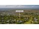 Aerial view of 9 Marsh Island Ln nestled among lush trees, near the serene marsh and golf course at 9 Marsh Island Ln, Isle of Palms, SC 29451