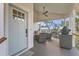 Inviting outdoor space with a ceiling fan, barbecue grill, and comfortable seating at 9 Marsh Island Ln, Isle of Palms, SC 29451