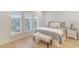 Cozy bedroom with hardwood floors, plantation shutters, and comfortable furnishings at 9 Marsh Island Ln, Isle of Palms, SC 29451