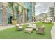 Inviting community space with outdoor seating and colorful condo buildings at 9 Marsh Island Ln, Isle of Palms, SC 29451