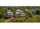 Lovely home exterior with a porch, nice curb appeal, and a view of the surrounding trees at 9 Marsh Island Ln, Isle of Palms, SC 29451