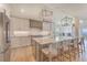 Bright kitchen with stainless steel appliances, large island, and pendant lighting at 9 Marsh Island Ln, Isle of Palms, SC 29451