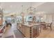 Open-concept kitchen with island, stainless steel appliances, and seamless flow to living area at 9 Marsh Island Ln, Isle of Palms, SC 29451