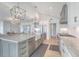 Spacious kitchen featuring a large island, stainless steel appliances and ample storage space at 9 Marsh Island Ln, Isle of Palms, SC 29451