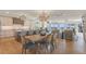 Bright and airy living area with hardwood floors, modern lighting, and gourmet kitchen view at 9 Marsh Island Ln, Isle of Palms, SC 29451