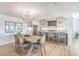 Bright and airy living area with hardwood floors, modern lighting, and gourmet kitchen at 9 Marsh Island Ln, Isle of Palms, SC 29451