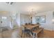 Bright and airy living area with hardwood floors, modern lighting, and staircase at 9 Marsh Island Ln, Isle of Palms, SC 29451
