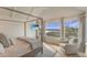 Main bedroom with a four-poster bed, flat-screen television, and amazing waterfront views at 9 Marsh Island Ln, Isle of Palms, SC 29451