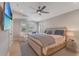 Airy main bedroom features hardwood floors, a flat-screen tv, and a neutral color palette at 9 Marsh Island Ln, Isle of Palms, SC 29451