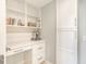 Pantry with built in desk, drawers, shelves, and abundant storage space at 9 Marsh Island Ln, Isle of Palms, SC 29451
