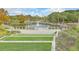 Scenic view of pond with fountain, walkways, and grassy areas at 9 Marsh Island Ln, Isle of Palms, SC 29451