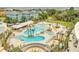 Aerial shot of community pools and lounge areas surrounded by palm trees at 9 Marsh Island Ln, Isle of Palms, SC 29451