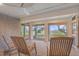 Relaxing screened porch with rocking chairs and peaceful views of the marsh at 9 Marsh Island Ln, Isle of Palms, SC 29451
