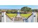 Scenic walkway with green space offers serene views of the beach at 9 Marsh Island Ln, Isle of Palms, SC 29451