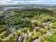 Aerial shot featuring a residential area with lush trees and scenic views of the waterfront at 1 Colleton Dr, Charleston, SC 29407