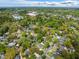 Breathtaking aerial view revealing a charming community nestled among vibrant green trees and neighborhood streets at 1 Colleton Dr, Charleston, SC 29407