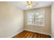Cozy bedroom with hardwood floors, ceiling fan, and natural light at 1 Colleton Dr, Charleston, SC 29407