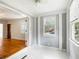 Bright sunroom featuring freshly painted walls and hardwood floors at 1 Colleton Dr, Charleston, SC 29407