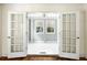 Sunroom with French doors and freshly painted walls at 1 Colleton Dr, Charleston, SC 29407