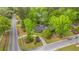 An elevated view of a well-maintained property, mature trees, and lush landscaping on a corner lot at 100 Nighthawk Ln, Summerville, SC 29485
