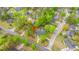 An elevated view of a well-maintained property, mature trees, and lush landscaping on a corner lot at 100 Nighthawk Ln, Summerville, SC 29485
