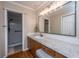 Bathroom with granite countertop vanity and white subway tile shower with glass door at 100 Nighthawk Ln, Summerville, SC 29485
