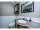 Bathroom featuring granite vanity, framed mirror, updated lighting and wood-look floors at 100 Nighthawk Ln, Summerville, SC 29485